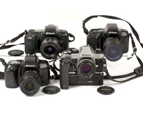 Four Nikon 35mm Cameras. Comprising chrome Nikon FA with Nikkor 50mm f1.8 AiS lens (condition 5E) and MD-15 motorwinder; Niko