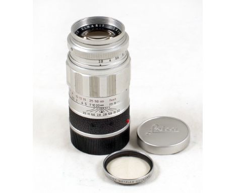 Leica Elmarit M 90mm f2.8 Lens. #2045045 (slight wear to blades, otherwise condition 5F). With UV filter and caps.