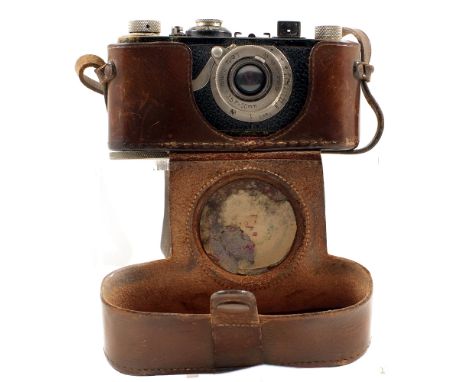 Leica 1a #16517 with fixed nickel Elmar 50mm f3.5 Lens. (condition 6F) with wear and paint loss commensurate with age. In eve