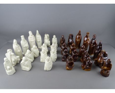 A RARE SET OF CERAMIC CHESS PIECES of stylized form by Margaret Holder (possibly ex Poole pottery), 17.5 cms high the King, (
