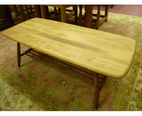 A LIGHT WOOD ERCOL COFFEE TABLE with base rack shelf, 104 x 46 cms