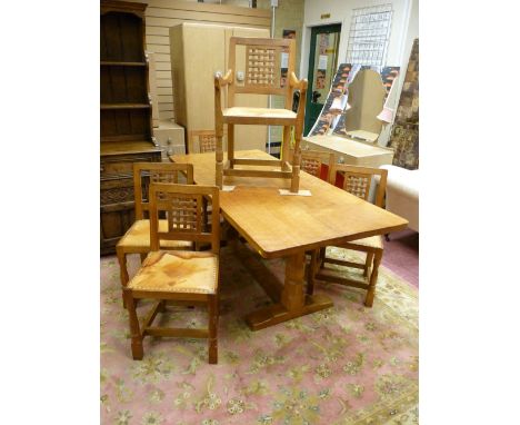 A ROBERT 'MOUSEMAN' THOMPSON ADZED TOP REFECTORY DINING TABLE and six (four plus two) lattice back dining chairs, all having 