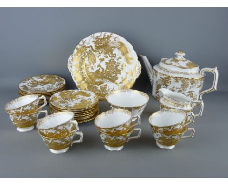 A TWENTY EIGHT PIECE ROYAL CROWN DERBY GOLD AVES TEASET to include eight place setting trios, lidded teapot, milk jug and sug