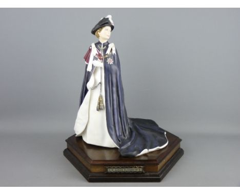 A ROYAL WORCESTER QUEEN'S REGNANT OF ENGLAND FIGURINE 'H M Queen Elizabeth II', limited edition (107/250), on a hexagonal woo