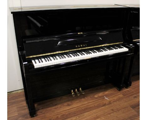 Kawai (c1960) A Model K-8 upright piano in a bright ebonised case.