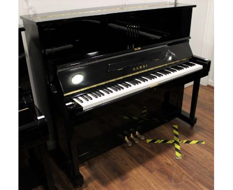 Kawai (c1961) A Model K-8 upright piano in a bright ebonised case.