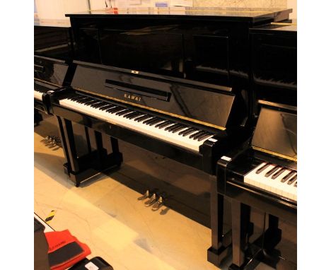 Kawai (c1967) A Model K-35 upright piano in a bright ebonised case.