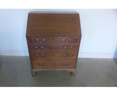 A Georgian oak four drawer bureau on shaped bracket feet with good colour and patina, 107cm tall x 81cm wide 