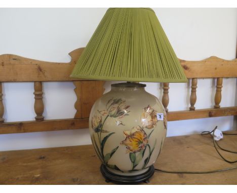 A floral ceramic table lamp with shade, 59cm tall 