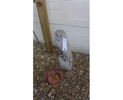 A cast stone garden sculpture of a barn owl, 41cm H, together with an Art Nouveau style wall pocket/planter 30cm H 