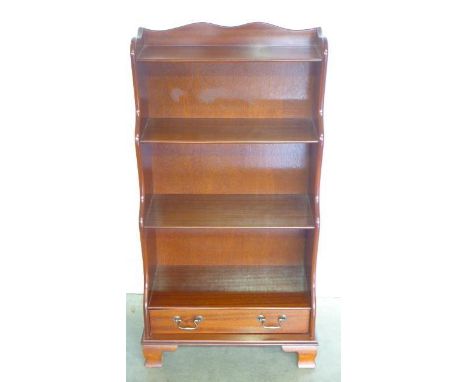 A small very attractive mahogany bookcase with a lower drawer, mounted on bracket feet - 113cm H x 57cm W - in polished condi