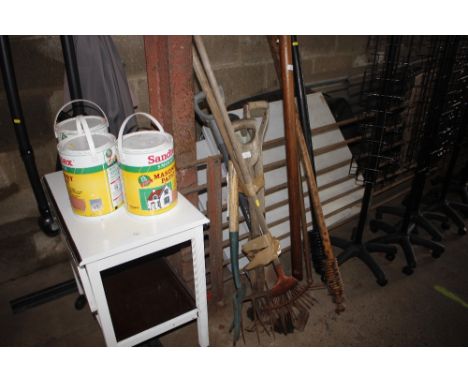 A bundle of long handled gardening tools 