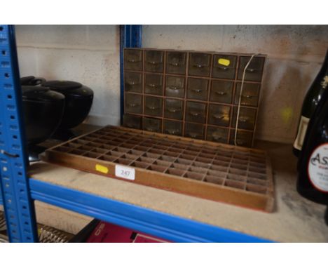 A nest of drawers and wall mounting display shelf