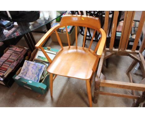 An Ercol style elbow chair 