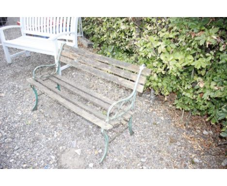 A cast iron and wooden garden bench, AF