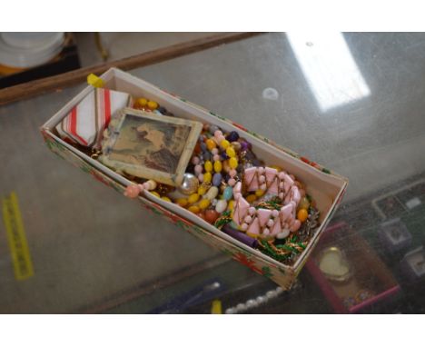 A box of various costume jewellery to include bead necklaces, bangle etc.