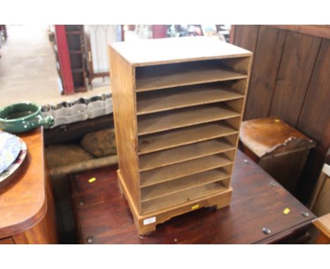 A pine table top storage shelf