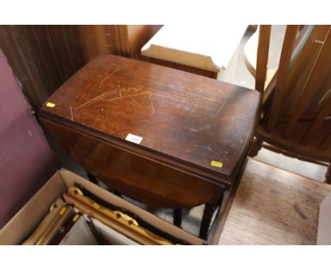 An oak barley twist gate leg table 