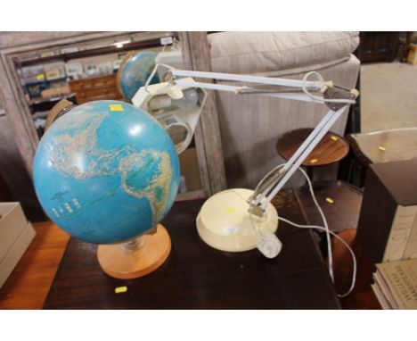 An angle poise style lamp; and a world globe