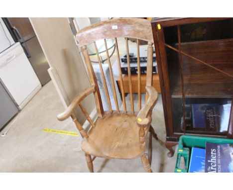 An elm seated stick back elbow chair