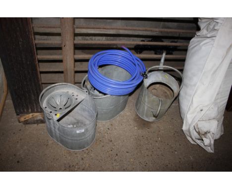 Two galvanised mop buckets; a galvanised watering can; and quantity of plastic covered pipe 