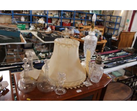 A cut glass and silver plated mounted claret jug; a glass table lamp and shade; three decanters etc.