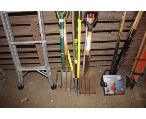 A quantity of long handled garden tools to include spade and forks