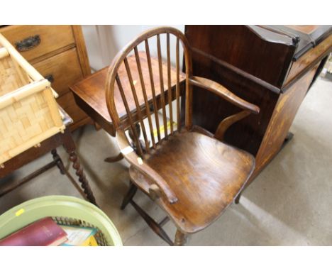 An elm seated stick elbow chair, reduced; and a side table fitted single drawer