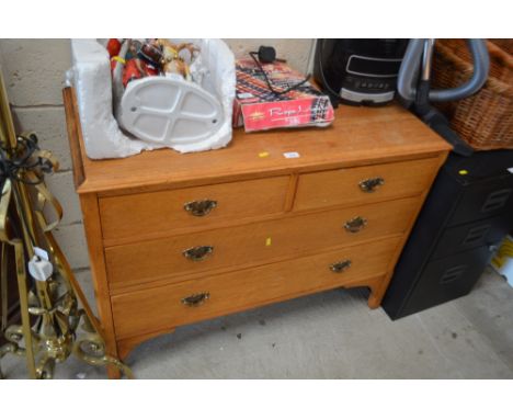 A light oak chest fitted two short over two long drawers 