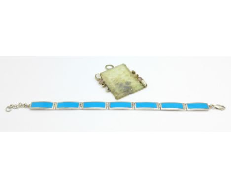 A silver bracelet and a jade pendant
