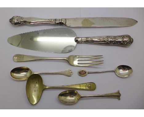 Three silver spoons, a silver fork, a bread knife and a cake knife with silver handles, and a feeding spoon, silver 75g