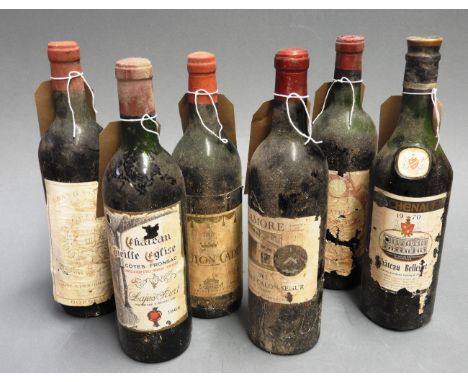 A collection of six vintage bottles of red wine, of various conditions, makers and years (6)