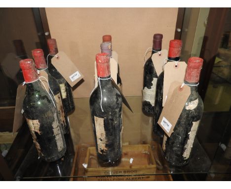 A collection of nine vintage bottles of red wine, of various conditions, makers and years (9) (AF)