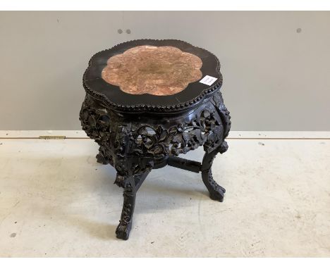 A Chinese circular hardwood rouge marble topped jardiniere stand, diameter 42cm, height 47cm Some light scratches to inset ro
