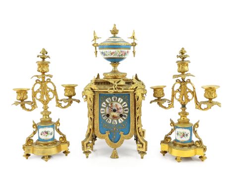 A 19th century French ormolu and Sevres style porcelain clock garniture, the mantel clock with floral painted urn finial and 