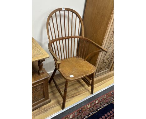 An elm and beech Windsor comb back elbow chair, width 65cm, depth 42cm, height 108cm