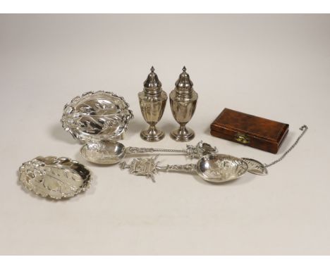 Small silver including a pair of Edwardian silver pepperettes, London, 1906, two continental import marked silver spoons, a s