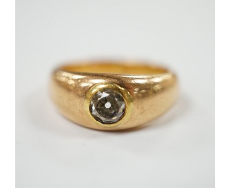A 750 yellow metal and gypsy set solitaire diamond ring, size K, gross weight 6.4 grams.
