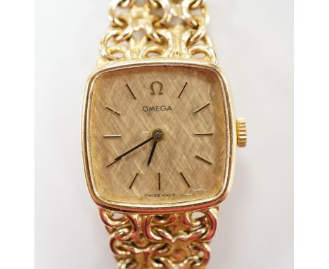 A lady's 1970's 9ct gold Omega manual wind wrist watch, on integral Omega 9ct gold bracelet, approximately 16cm, gross weight