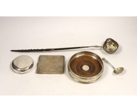 A modern silver mounted wine coaster, a silver sifter spoon, sterling cigarette case, silver tobacco box and a white metal to