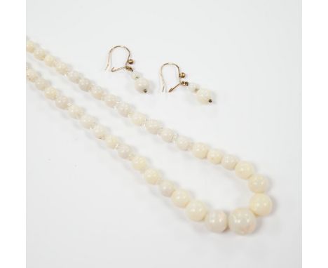 A single strand graduated white opal bead necklace, with 9ct clasp, 50cm and a pair of similar drop earrings.