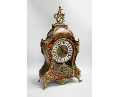 A simulated tortoiseshell Boulle work mantel clock, striking on a bell, 57cm high