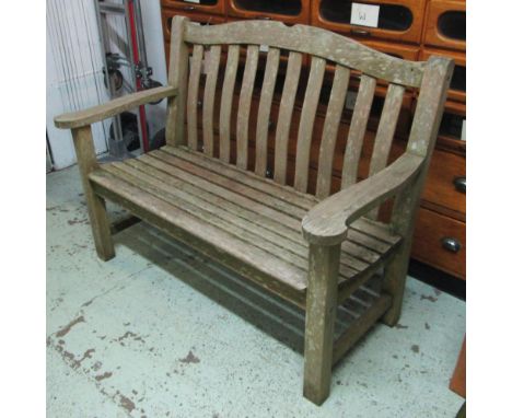 GARDEN BENCH, weathered teak with arched back by 'Nova' 128cm W.