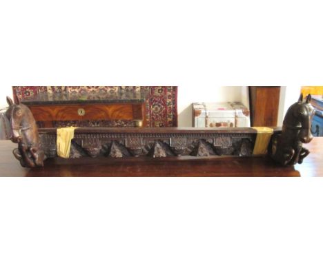 MANTEL SHELF, possibly Indian, hardwood, carved a stylised foliate frieze flanked by rearing horses, 124cm L. 