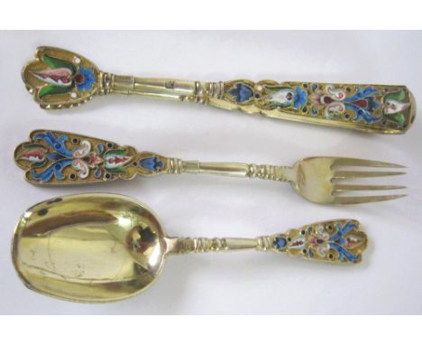 RUSSIAN FORK, SPOON AND TONGS, in silver gilt and enamel. (3)