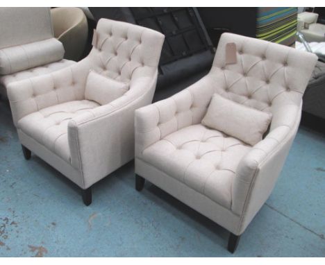 EASY CHAIRS, a pair, button back in oatmeal fabric on front castors. (2)