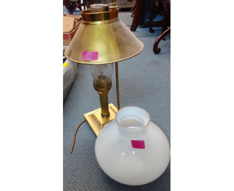 A brass table lamp in the form of an oil lamp having an additional milk glass shade and anotherLocation: RWB 