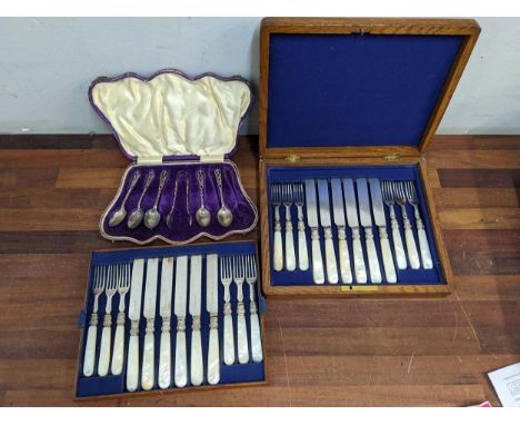 Silver teaspoons, and matching sugar tongs, and a silver plated and mother of pearl dessert service Location: 