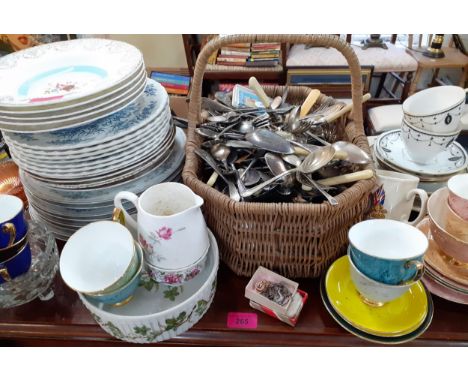 A quantity of 20th century china and glass to include Royal Albert tea cups and saucers together with a basket of mixed cutle
