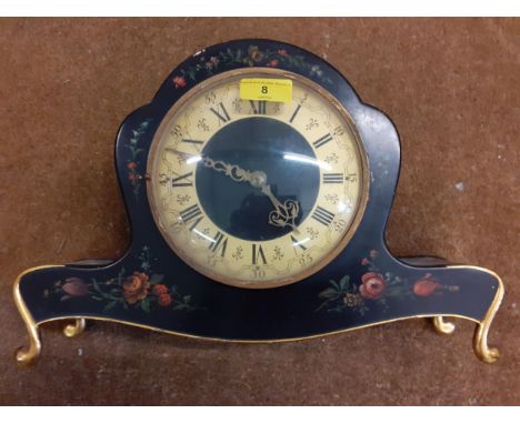 A double faced clock in a painted black case decorated with floraLocation: R2:2 